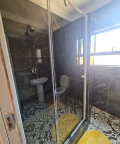 Onyx Family Suite large family bedroom with twin and double beds overlooking garden area at Quereba Bed and Breakfast Mafikeng.