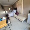 Amethyst Family Suite bedroom with double bed, cozy decor, and garden view at Quereba Bed and Breakfast Mafikeng.