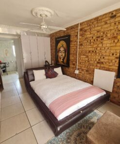Emerald Standard Suite bedroom with simple decor and soft lighting at Quereba Bed and Breakfast Mafikeng.
